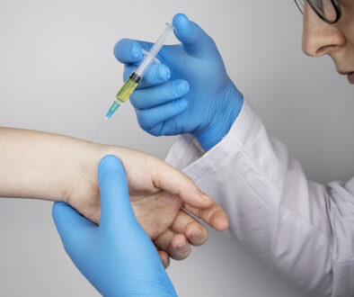 Closeup of an Arthritis Specialist Injecting a Cortisone Shot Into a Patient’s Wrist Joint Stages of Rheumatoid Arthritis