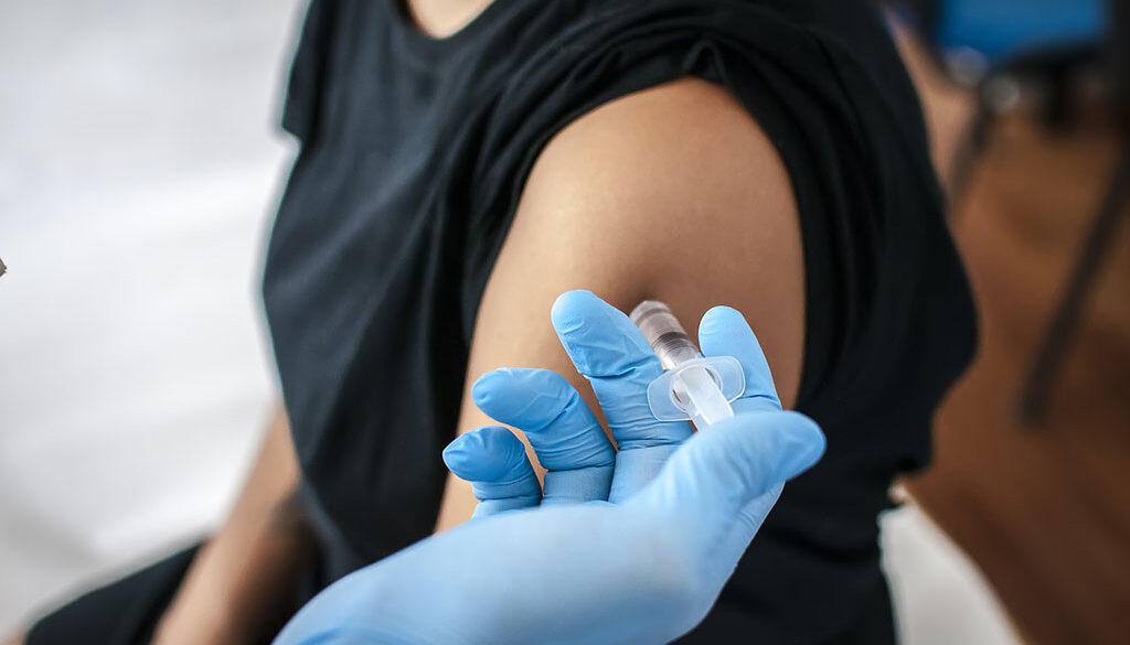 Closupe of a Adult Medicine Doctor Injecting a Vaccine Into a Patient’s Arm Meningitis Vaccine Side Effects